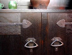 Close-up hand-hammered door hardware.